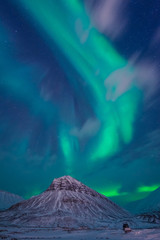 Wall Mural - the polar arctic northern lights aurora borealis sky star in norway svalbard in longyearbyen with th