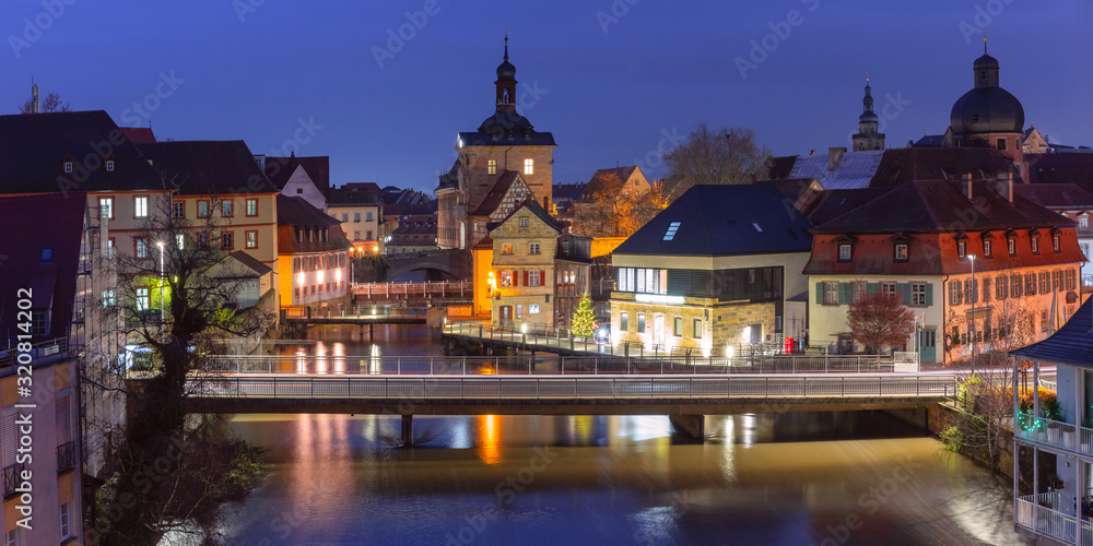 Aerial panoramic view of Old town hall or Altes Rathaus with bridges over the Regnitz river at night in Bamberg, Bavaria, Upper Franconia, Germany - obrazy, fototapety, plakaty 