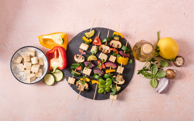 Skewers with vegetables and tofu on grill frying pan, ingredients for vegan grilling, clean eating