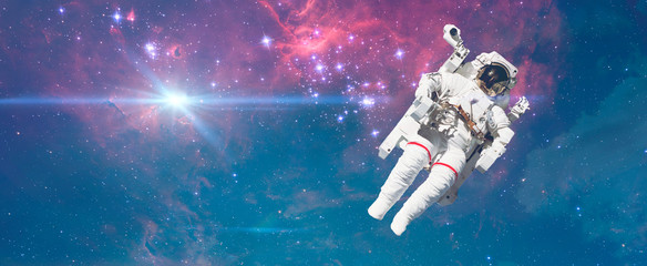 Wall Mural - creative concept of happy astronaut fly high in the sky with clouds, relax chill and dream idea elem