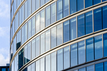 Close Up View Of Detail On A Modern Glass Building With Reflective Glass And Contemporary Design.