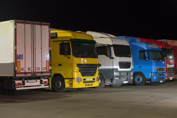 Poster - Trucks semi-trailers in the parking lot at night