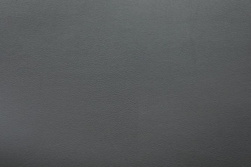 texture of dark grey leather as background, closeup