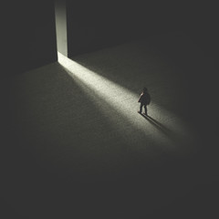 man walking in the night following light