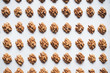 Pattern of walnuts on a white background. Top view on a nuts pattern.