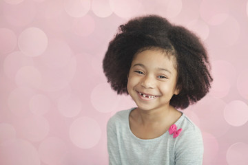 Wall Mural - Happy adorable african american child girl isolated on pastel background. Laughing face. Real emotions.