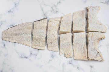 Sticker - salted dry cod fish on gray backgrpound