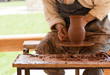 potter making pot, working with clay