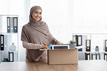 Wall Mural - Happy Woman Standing Near Box With Her Belongings In New Office