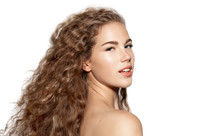 Beautiful Girl With Curly Hair Closeup Portrait. Young Caucasian Woman With Naked Shoulders And Hairstyle Isolated On White Copy Space Studio Shot. Female Beauty And Healthy. Femininity And Sensuality