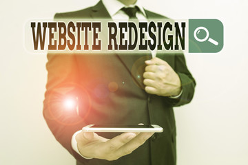 Wall Mural - Word writing text Website Redesign. Business photo showcasing modernize improver or evamp your website look and feel Male human wear formal work suit hold smart hi tech smartphone use one hand