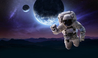Aufkleber - Astronaut in the space over the nightly planet Earth. Abstract wallpaper. Spaceman. Elements of this image furnished by NASA