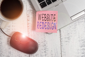 Wall Mural - Word writing text Website Redesign. Business photo showcasing modernize improver or evamp your website look and feel Trendy metallic laptop blank sticky note coffee cup mouse lying vintage