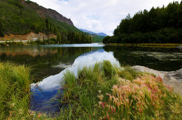 Wall Mural - Beautiful lake with mountain reflection along the Seward Highway, Alaska. The Seward Highway is a highway in the U.S. state of Alaska that extends 125 miles from Seward to Anchorage 