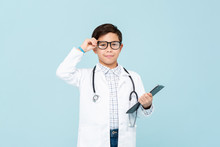 Smiling Smart Doctor Boy With White Medical Coat And Stethoscope