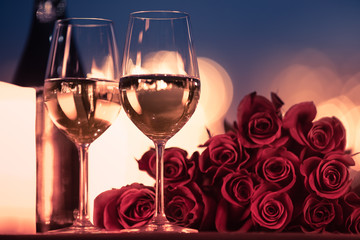 Dinner date night setting with roses and wine 
