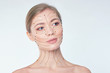 © yavdat - portrait of a young beautiful woman with drawn massage lines on her face. skin lifting concept. Close-up portrait of beautiful, fresh, healthy girl over white background