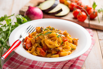 Canvas Print - tagliatelle pasta with eggpalnts and fresh tomatoes