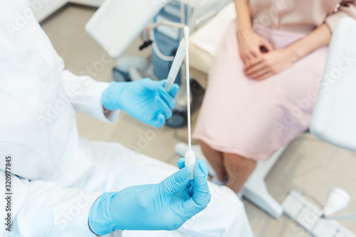 Fotomural Woman having test for sexually transmitted disease with doctor