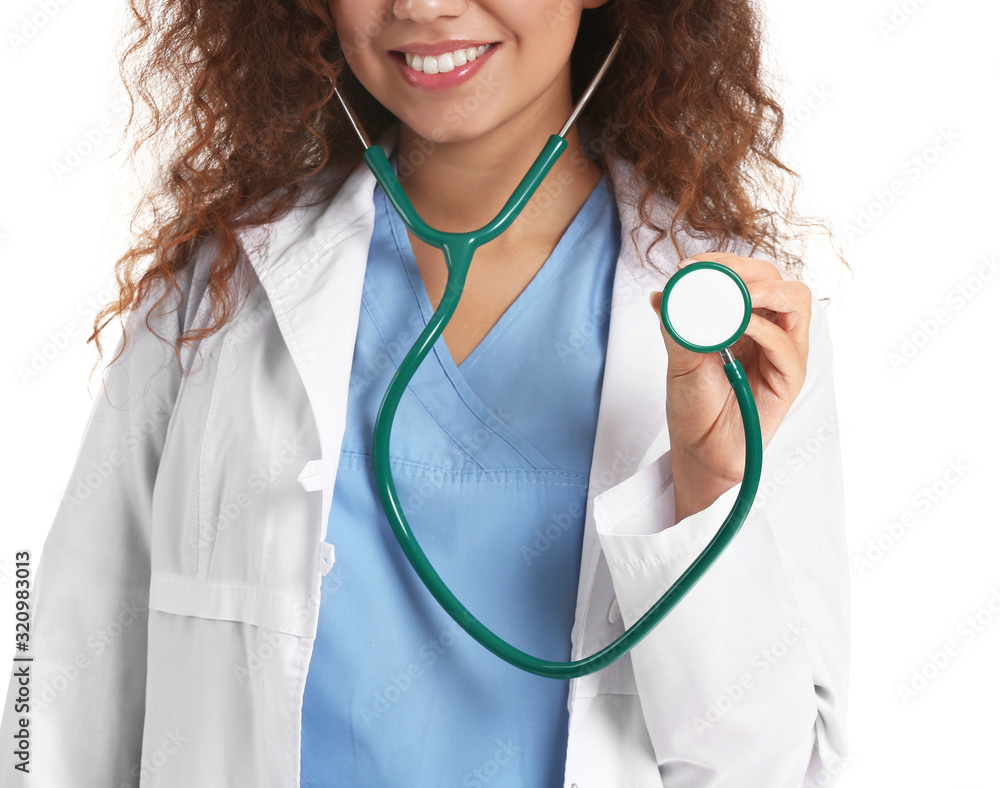 Young African-American doctor with stethoscope on white background
