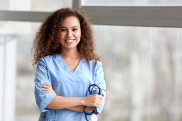 Sticker - Young African-American nurse in clinic