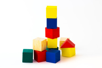 Toy wooden building blocks on white background