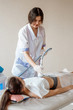 © Ilnur - Hardware cosmetology. Body care. Spa treatment. Ultrasound cavitation body contouring treatment. Woman getting anti-cellulite and anti-fat therapy in beauty salon.