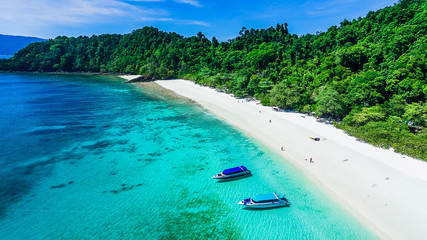 aerial top view beautiful nature scenic vacation beach bright and clear blue sea with boat for trave