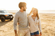 © Drobot Dean - Loving couple outdoors at beach walking.