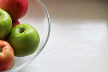 Red And Green Apple On A White Plate, Copy Space