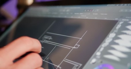 Wall Mural - an architect sketching and drafting out blueprints or concept art for a building project on a digita