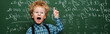 panoramic shot of kid in glasses having idea near chalkboard