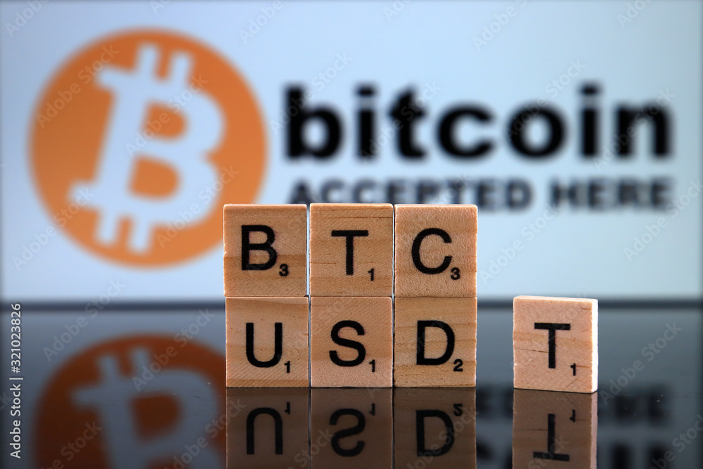WROCLAW, POLAND - FEBRUARY 04, 2020: Words BTC USDT made of small wooden letters. Tether (cryptocurrency, USDT) is called a stablecoin because it was originally designed to always be worth $1.00.