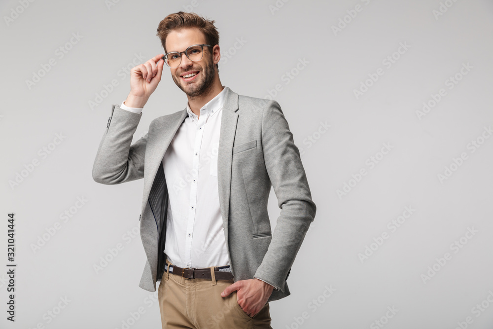 Portrait of happy young businessman posing at camera and smiling Stock ...