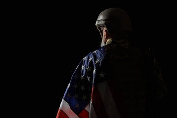 Back view of american veteran with flag.