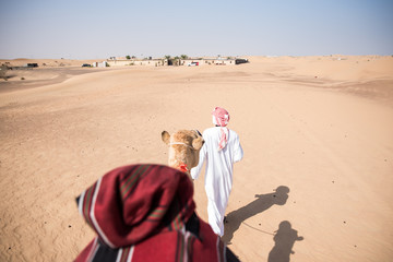 Dubai camel riding tourism Arab Emirates desert tour trip send