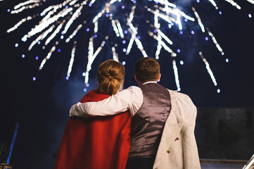 Wall Mural - man hugging woman watching fireworks