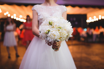 Wall Mural - bride holding white bouquet