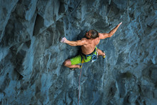 Powerful Sportive Rock Climber