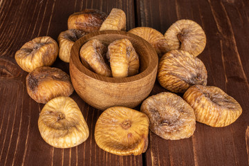 Wall Mural - Lot of whole dried fig on brown wood