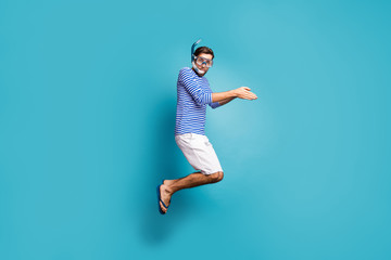 Poster - Full length profile photo of funky crazy guy tourist jump high swimming water mask tube diving wear striped sailor shirt vest shorts flip flops isolated blue color background