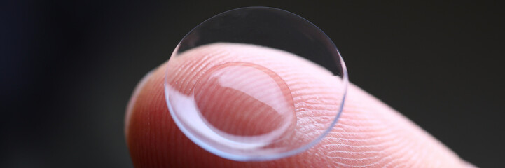 Sticker - Human finger holding soft contact lens