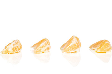 Wall Mural - Group of four pieces of peeled fresh orange mandarin isolated on white background