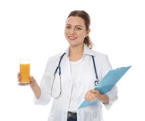 Wall Mural - Nutritionist with glass of juice and clipboard on white background