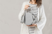 Stylish Fashionable Woman With Grey Round Bag