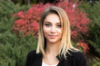 © hbrh - Portrait of nice young woman against background of summer green park red green leaves beautiful woman
