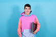 © carballo - portrait of teenage student with laptop isolated on blue background