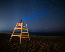 Lifeguard Stand On Beach At Night With Stars