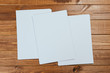 © Nana_studio - white paper on wood background and shadow