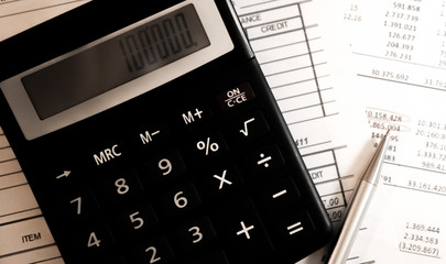 reduction of the financial balance and calculations on the calculator